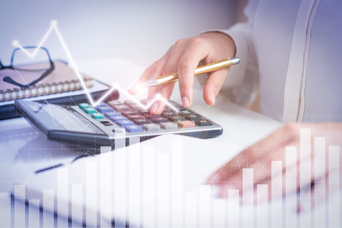 accountant-calculating-profit-with-financial-analysis-graphs-min