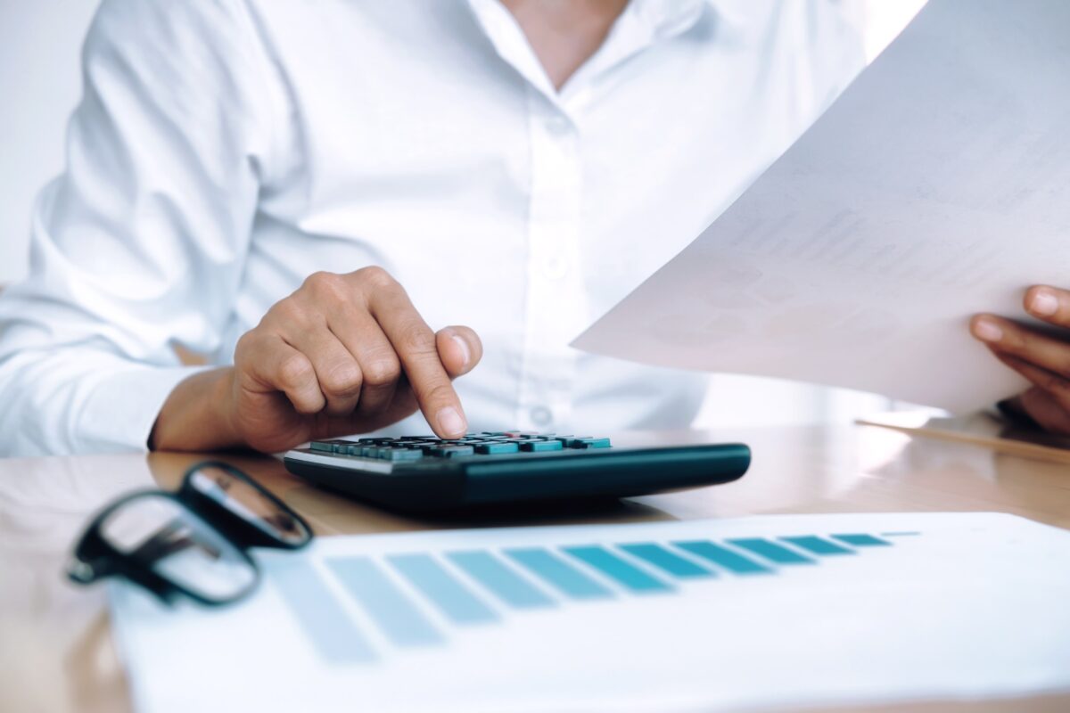 finances-saving-economy-concept-female-accountant-banker-use-calculator-min