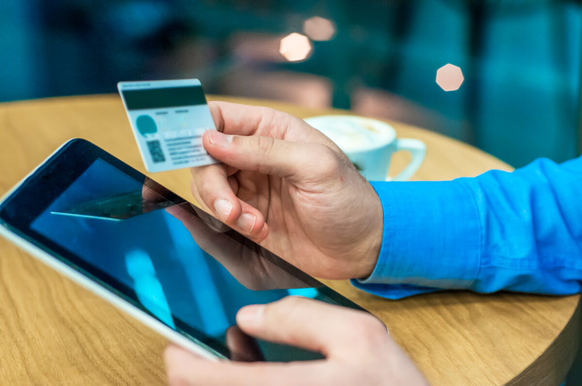 businessman-using-a-credit-card-and-digital-tablet-for-buying-on-line-man-buying-on-internet